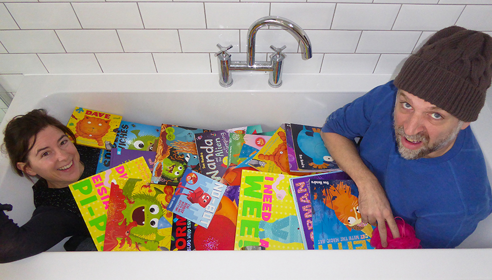 sue hendra and paul linnet in a bath of books
